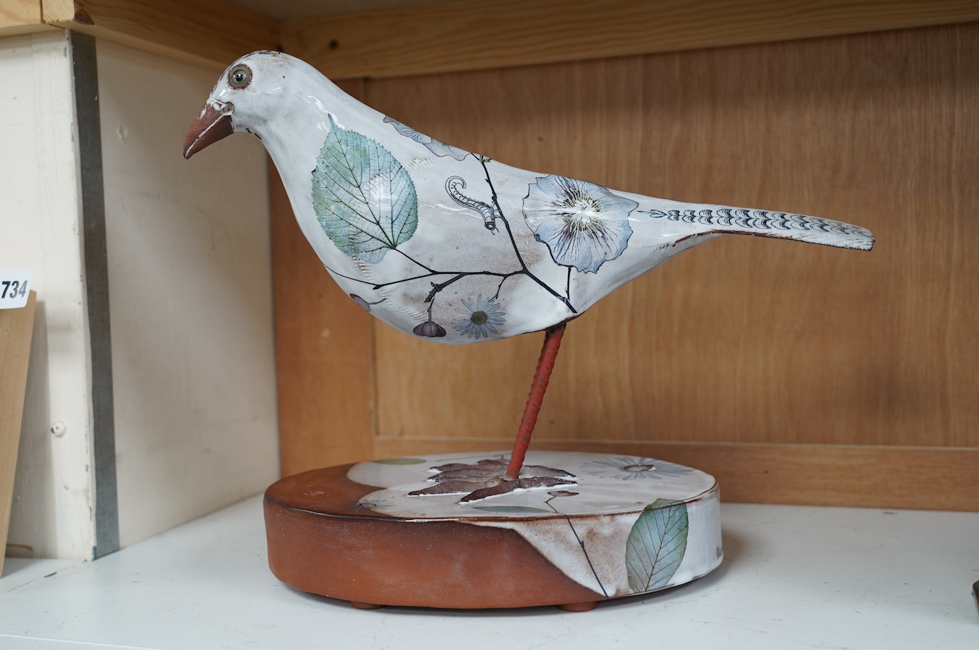 Marion Brandis (Modern British), a partially tin glazed art pottery model of a bird, 28cm tall. Condition - good